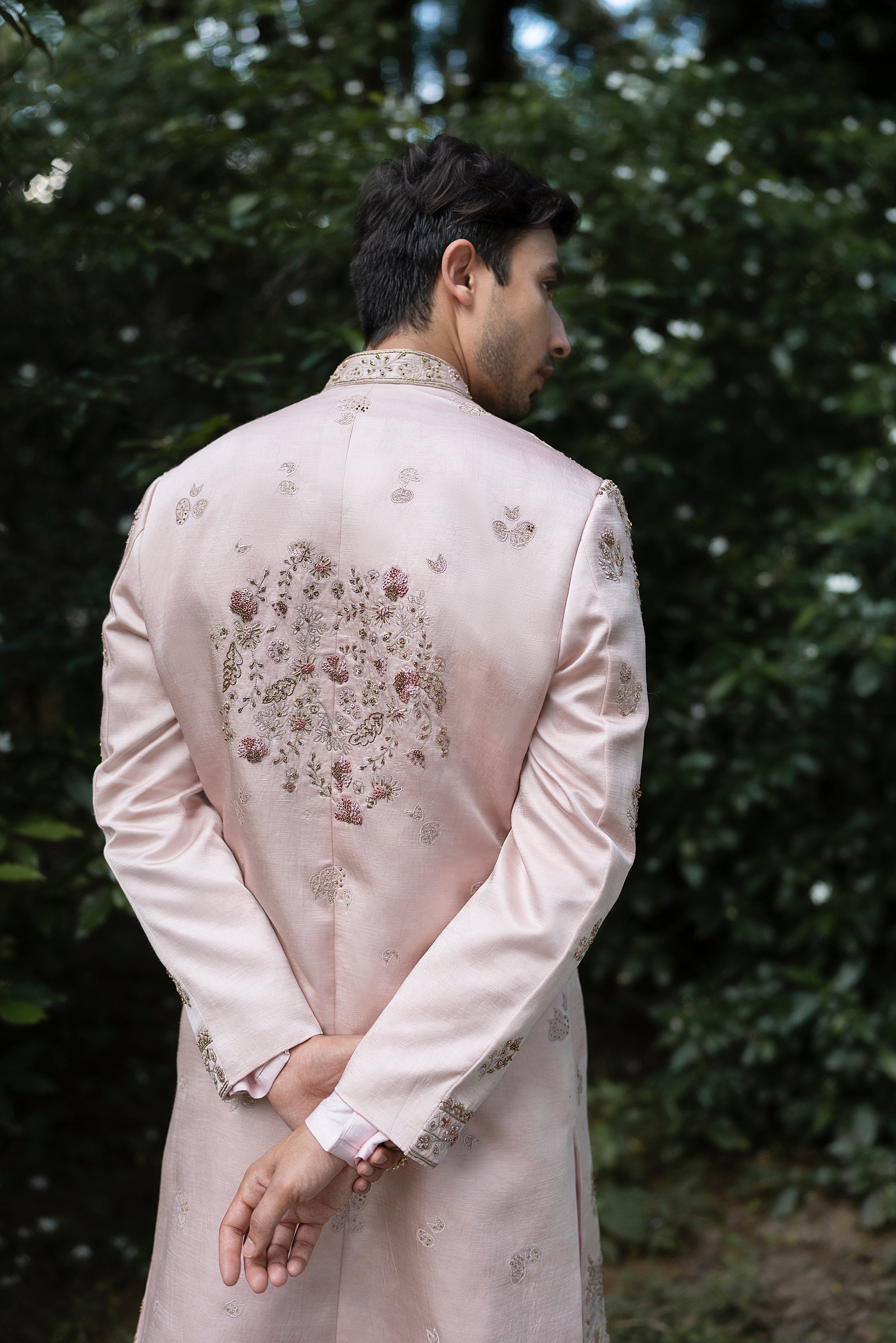 Front view of the Primerose Sherwani in blush pink linen silk, featuring intricate tone-on-tone aari embroidery with highlights of aari and zardosi work