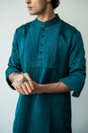 Close-up of the crinkled georgette fabric on the Jade Tamarisk Kurta, highlighting its textured surface and fluid drape.