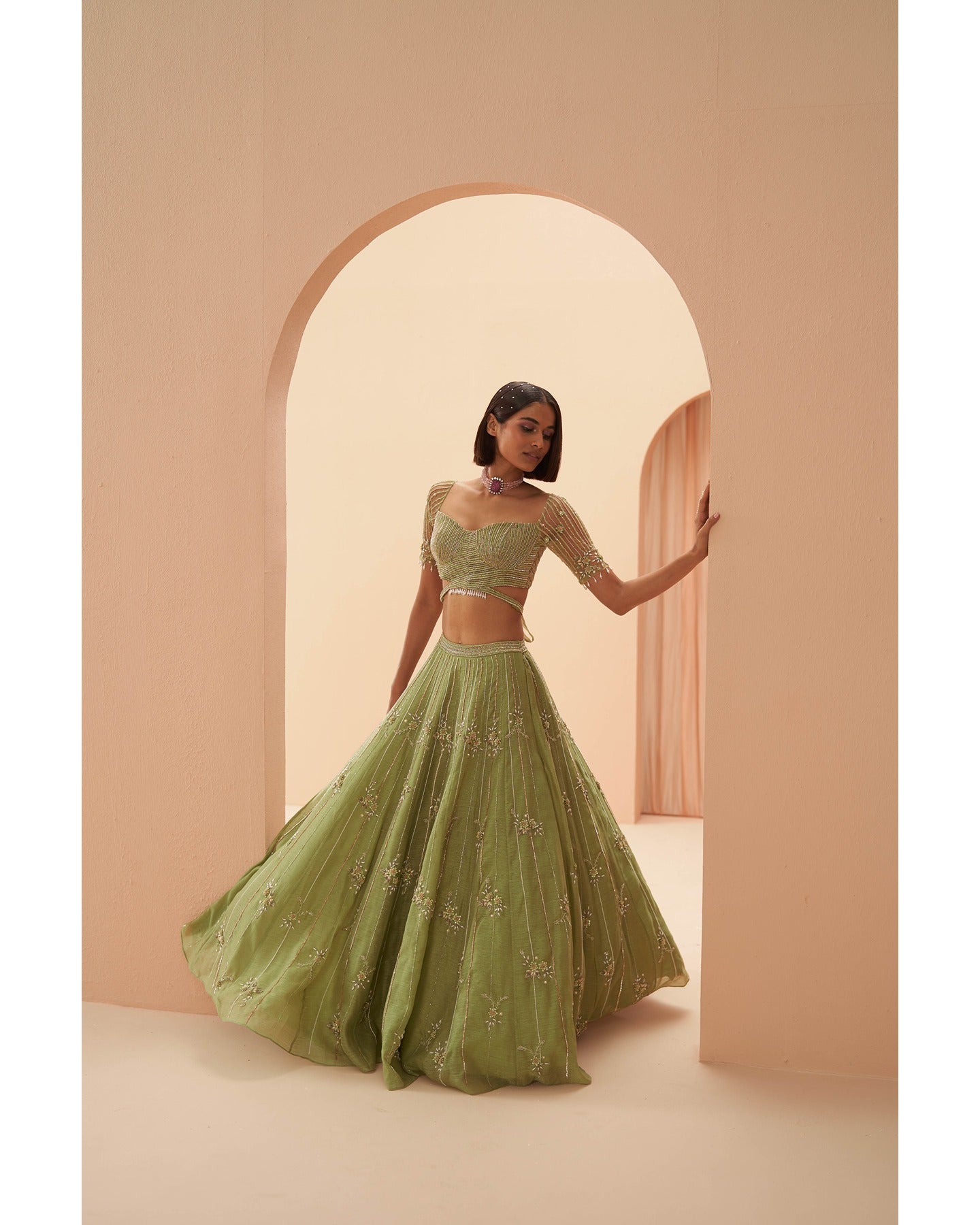 Enchanting in Jade: Hand-embroidered details adorn this green lehenga, a symphony of elegance and grace. 