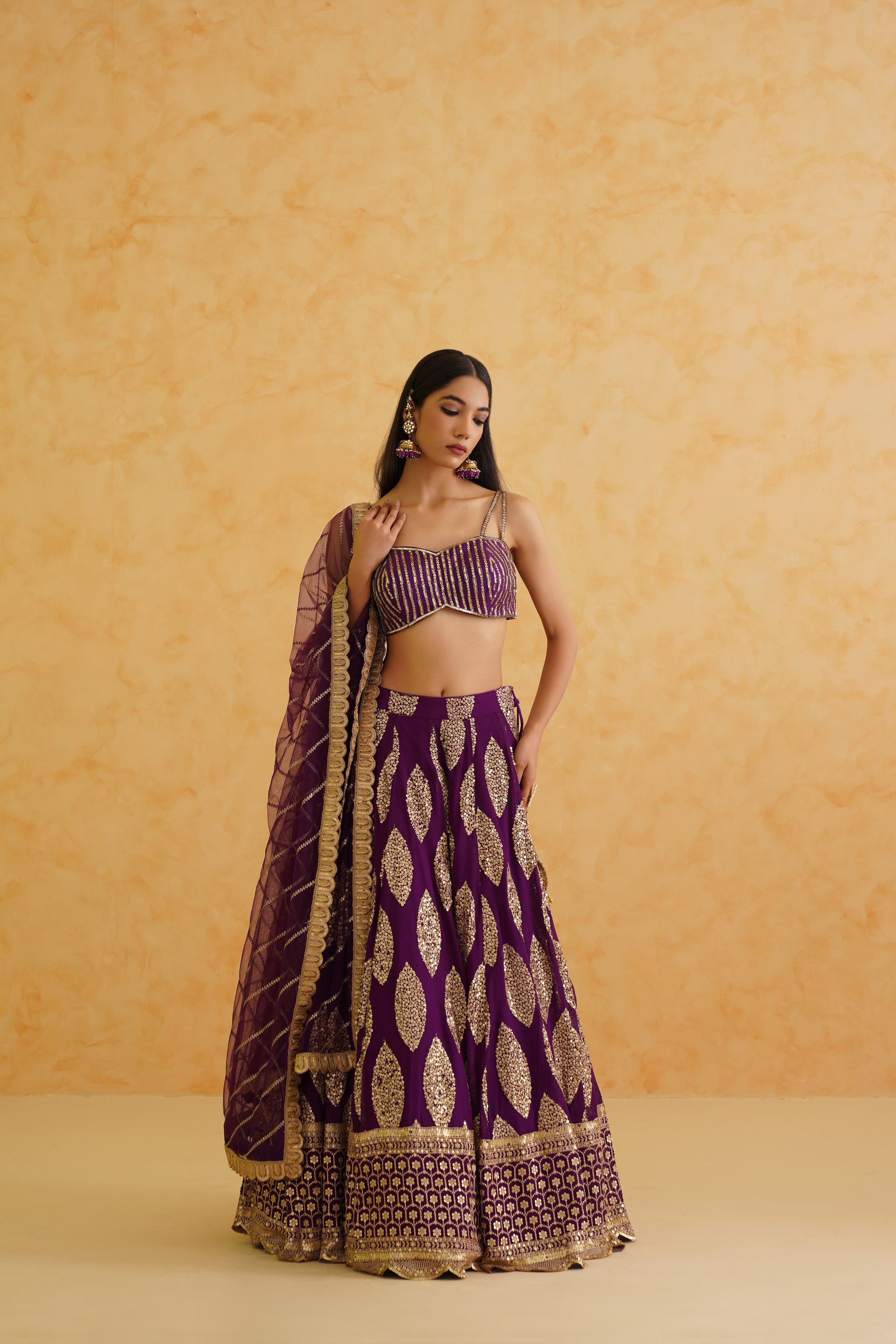 Flowy silhouette of the lehenga in rich purple, perfect for day or night events, ensuring both style and comfort.