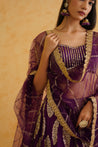 Elegant purple lehenga set showcasing a beautifully designed blouse that adds glamour and sophistication to any occasion.