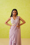 Flowy, full-length modern saree in soft mauve, designed with a stylish silhouette that exudes sophistication and grace.