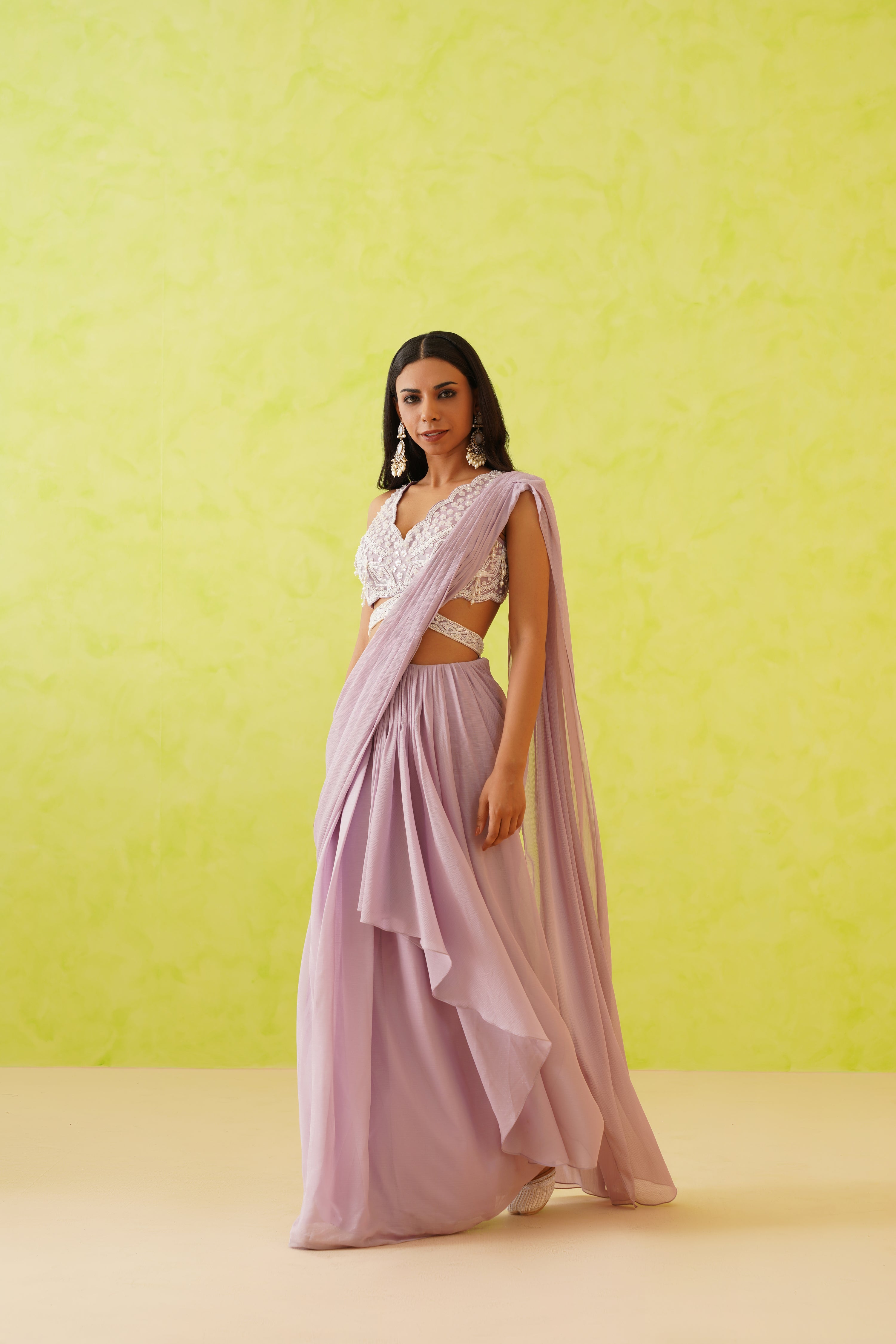 Sophisticated mauve color adds a touch of glamour, making this draped saree an ideal choice for elegant events.