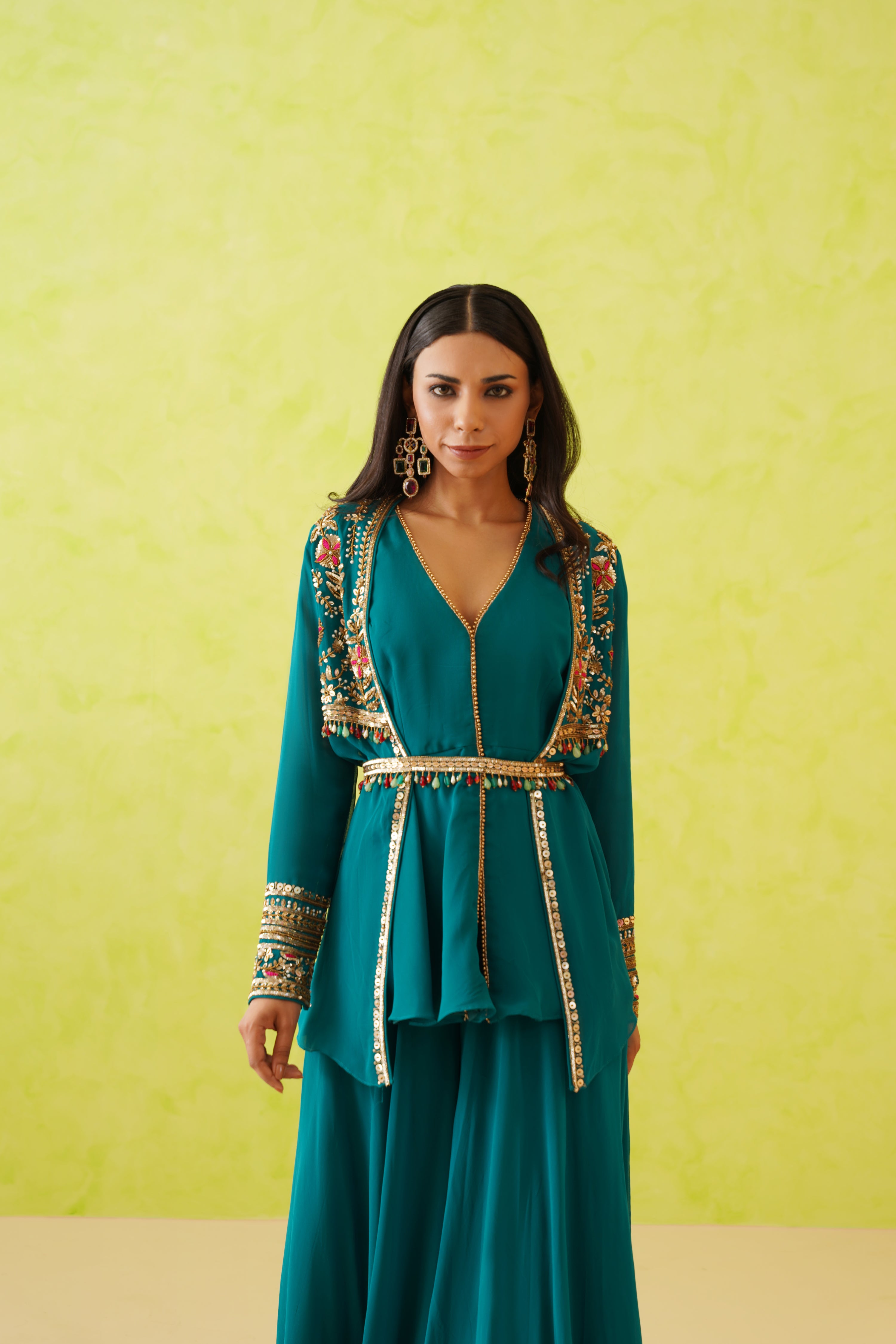 The long top and matching sharara create a sophisticated and comfortable ensemble.