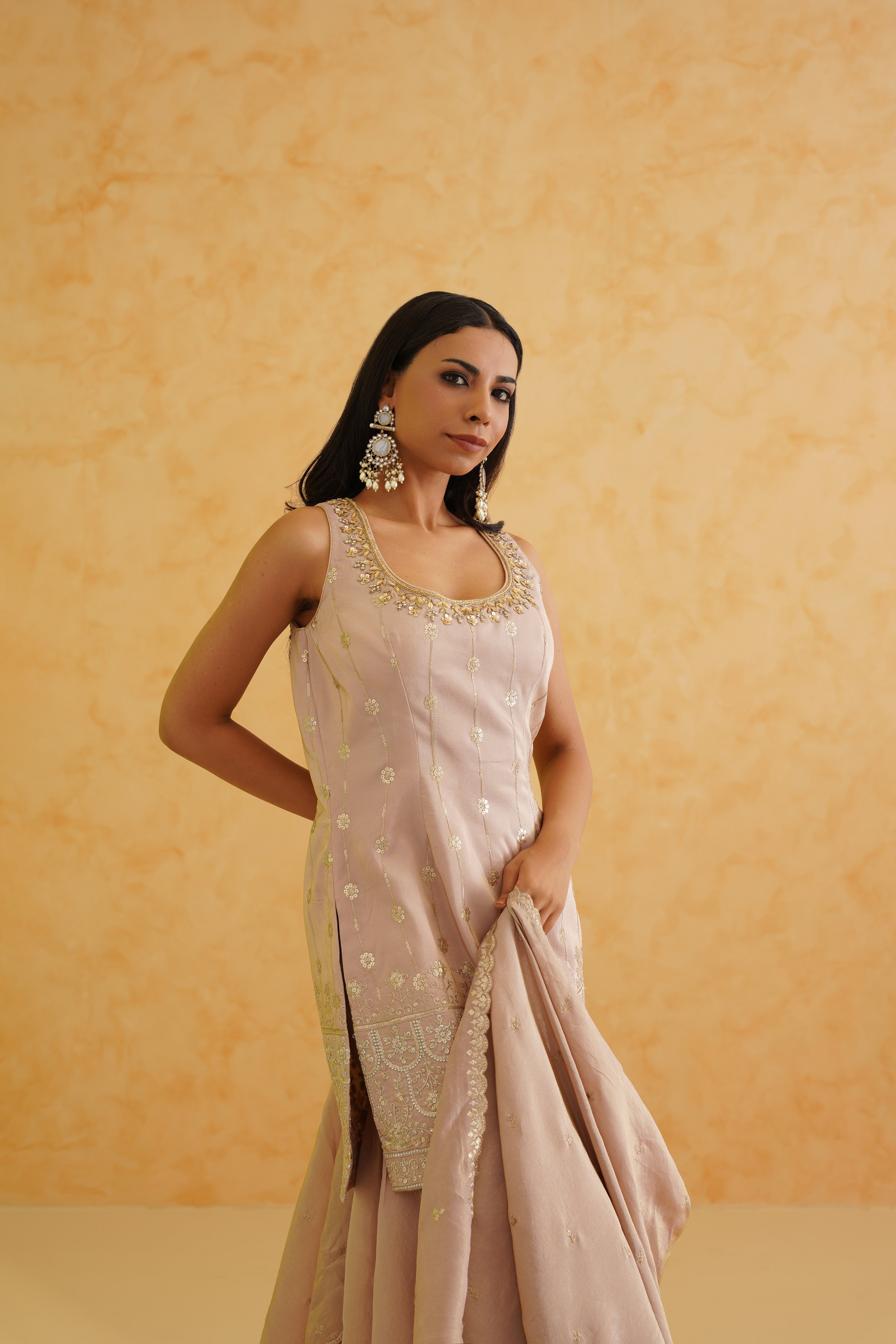 A delicate blush pink sharara set perfect for special occasions.