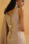 Deepika Chadha's blush pink georgette sharara set with intricate gold embroidery.