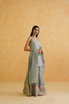 Deepika Chadha's elegant grey georgette sharara set with intricate gold embroidery.