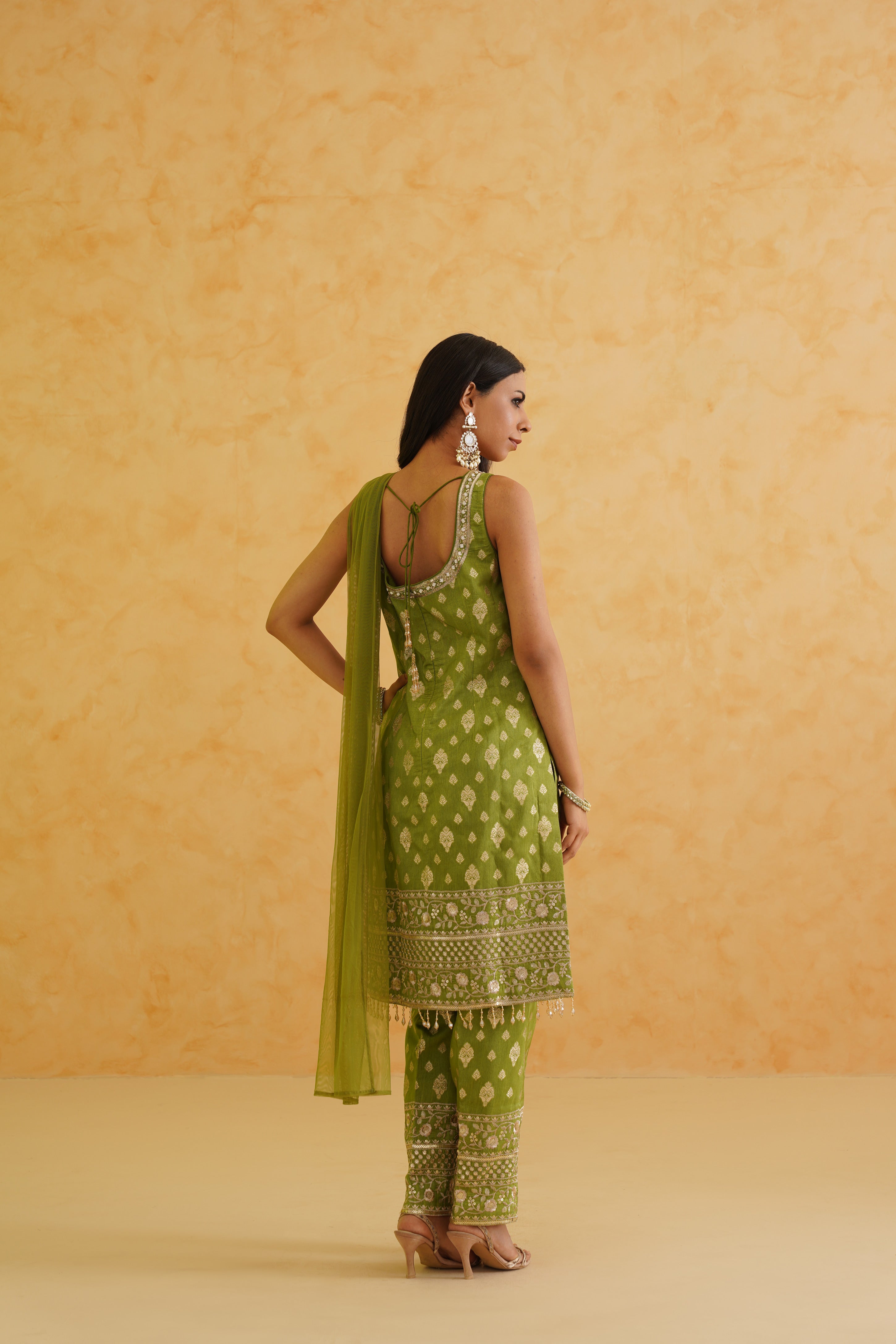 A festive green kurti ensemble perfect for special occasions.