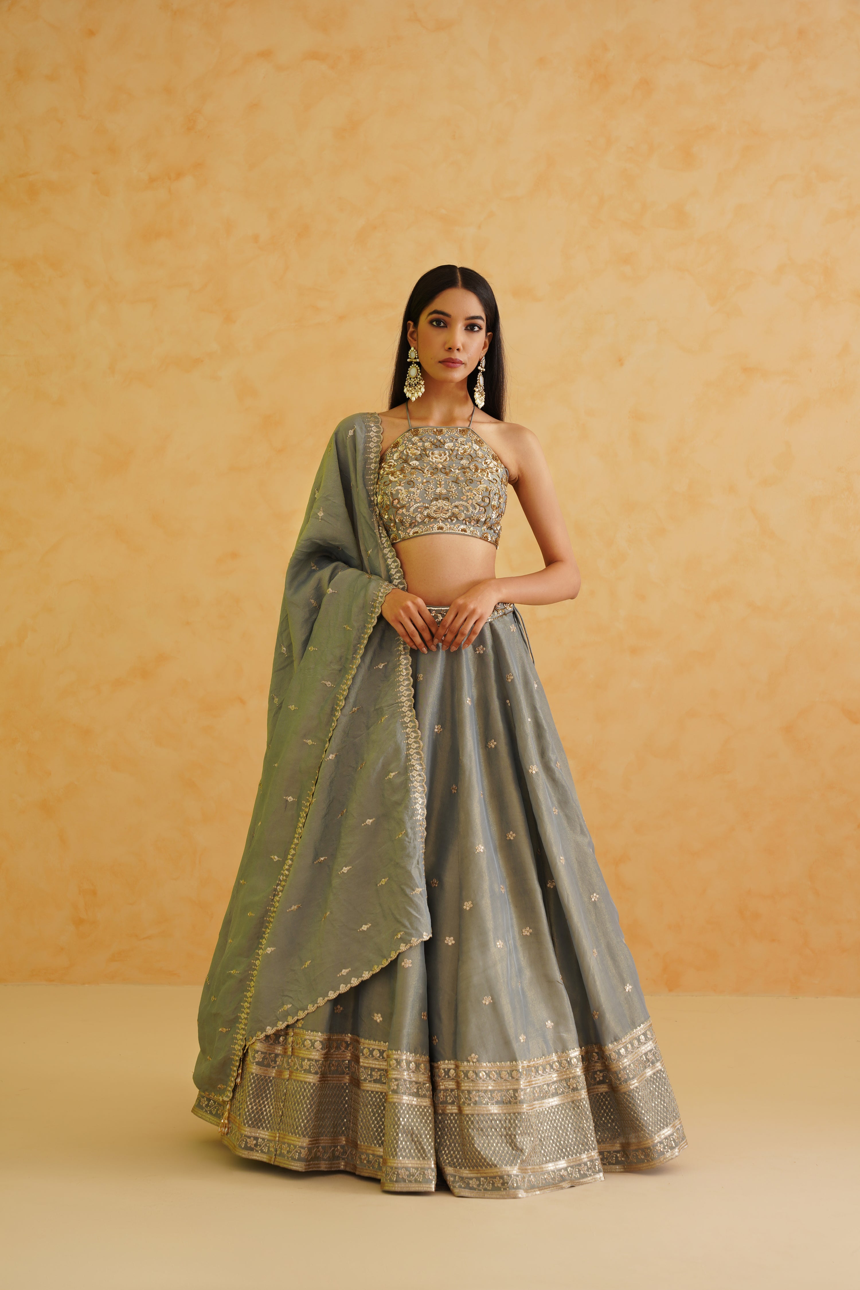 A sophisticated grey georgette lehenga set that exudes elegance and style, perfect for any special occasion.