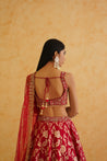 A sophisticated fuchsia brocade lehenga set that exudes elegance and style, perfect for any special occasion.
