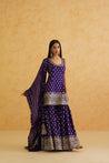 Purple brocade kurti with intricate embroidery and flowy sharara.