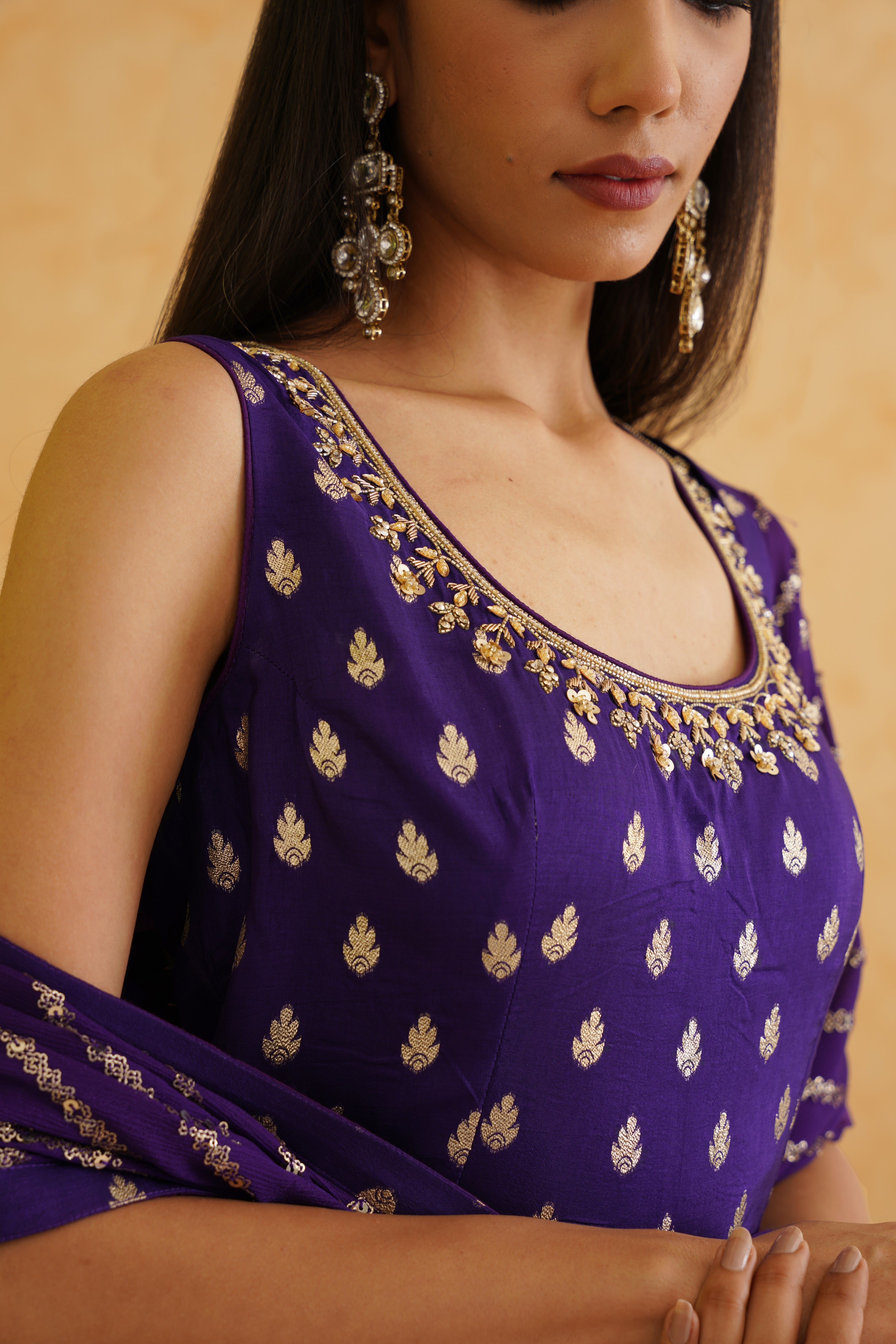 Deepika Chadha's stunning purple brocade kurti features intricate crystal, stone, and sequin embroidery. 