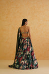 Dazzle in Deepika Chadha's bottle green lehenga, adorned with intricate gold crystal, sequin, and bead embroidery.