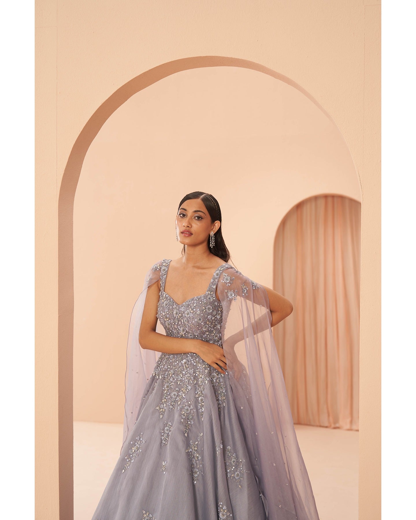 Lilac Whispers: Hand-embroidered elegance graces this dreamy gown, a vision of sophistication and charm. 