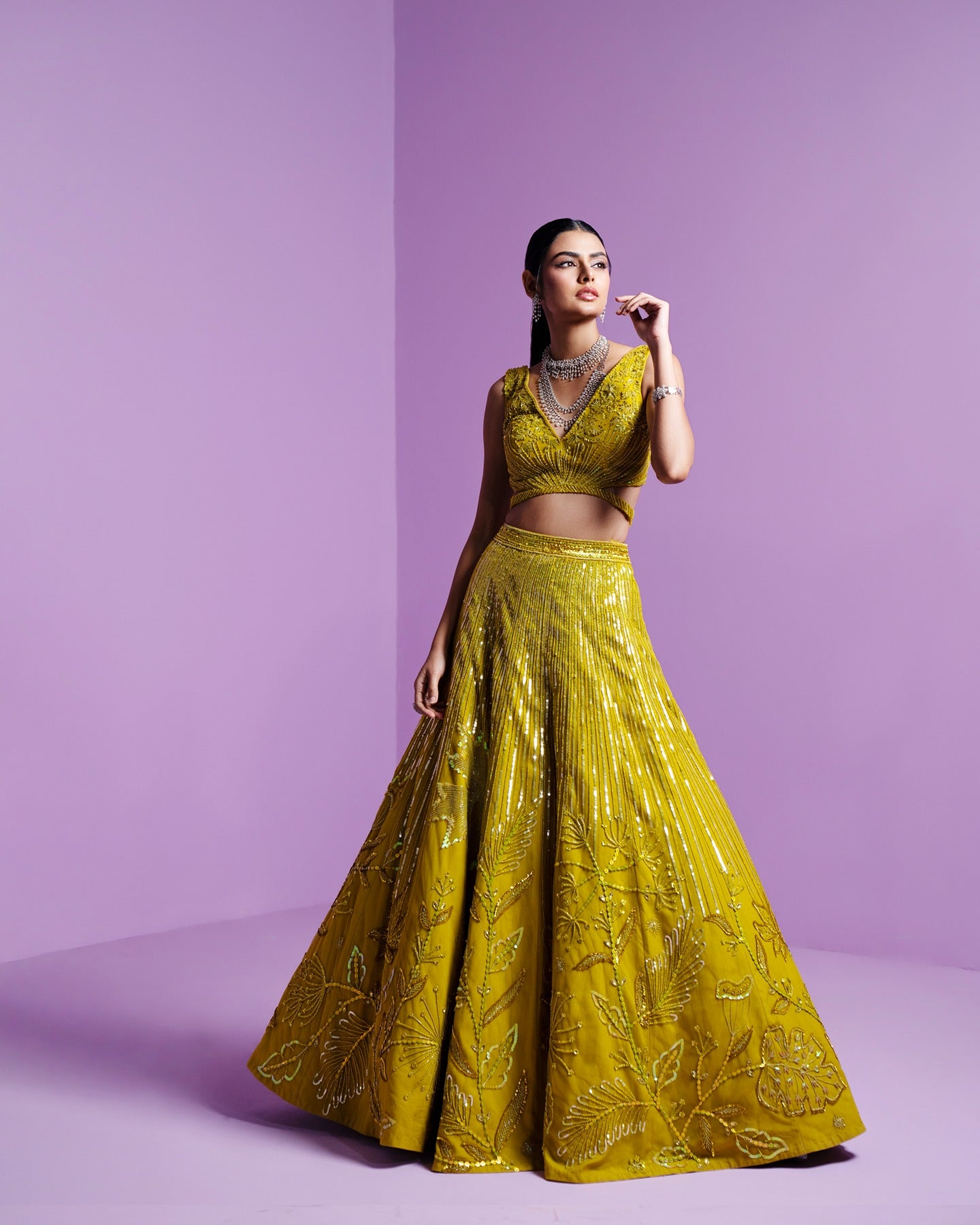 Drenched in the zest of lime green, this lehenga radiates vibrancy and joy. A burst of color that dances with every step, capturing the spirit of celebration and youthful exuberance.