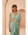 Mint Marvel: Hand-embroidered beauty graces this drape saree in a serene shade of mint green. 