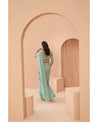 Mint Marvel: Hand-embroidered beauty graces this drape saree in a serene shade of mint green. 