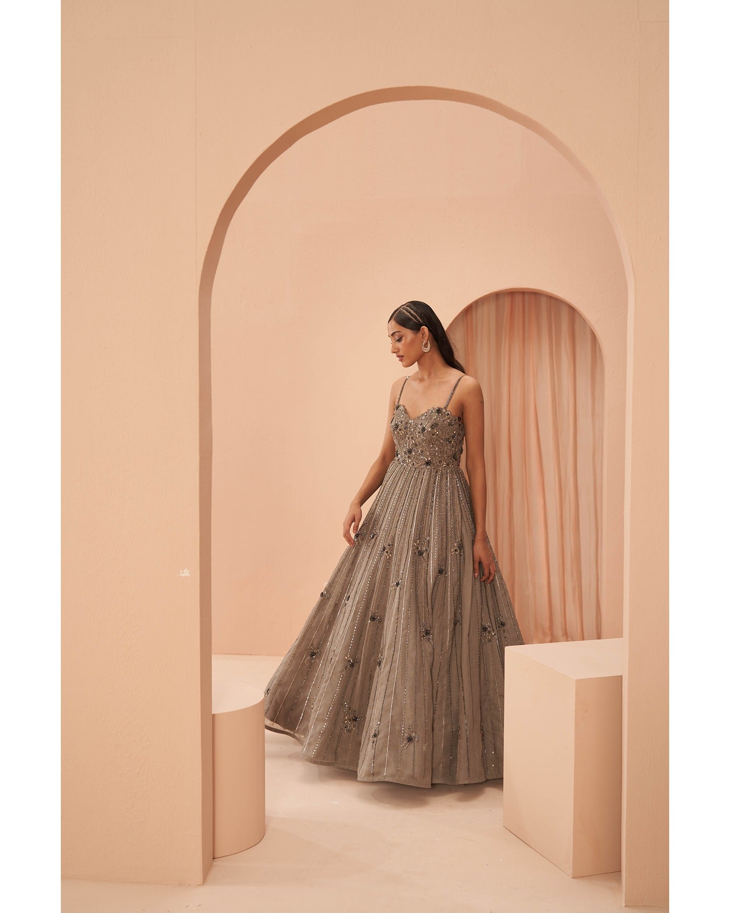 Sophisticated Taupe: Hand-embroidered allure graces this gown, a perfect blend of elegance and timeless charm. 