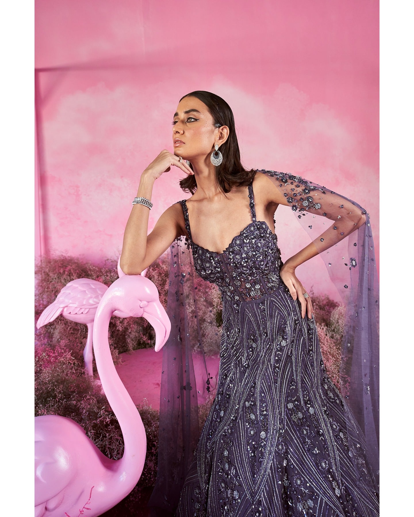 Royal allure in deep purple: A hand-embroidered gown that weaves elegance and mystique with every stitch.