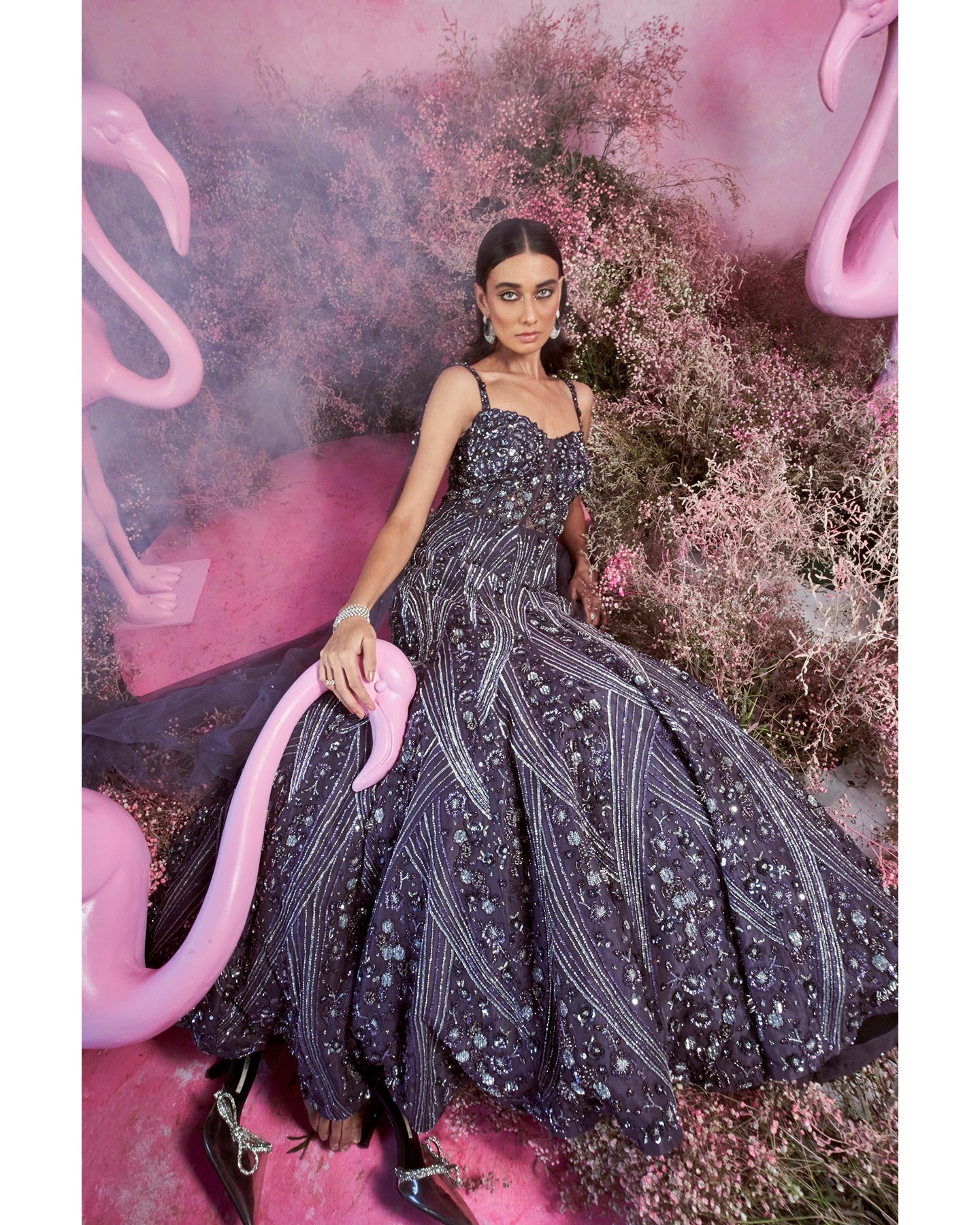 Royal allure in deep purple: A hand-embroidered gown that weaves elegance and mystique with every stitch.