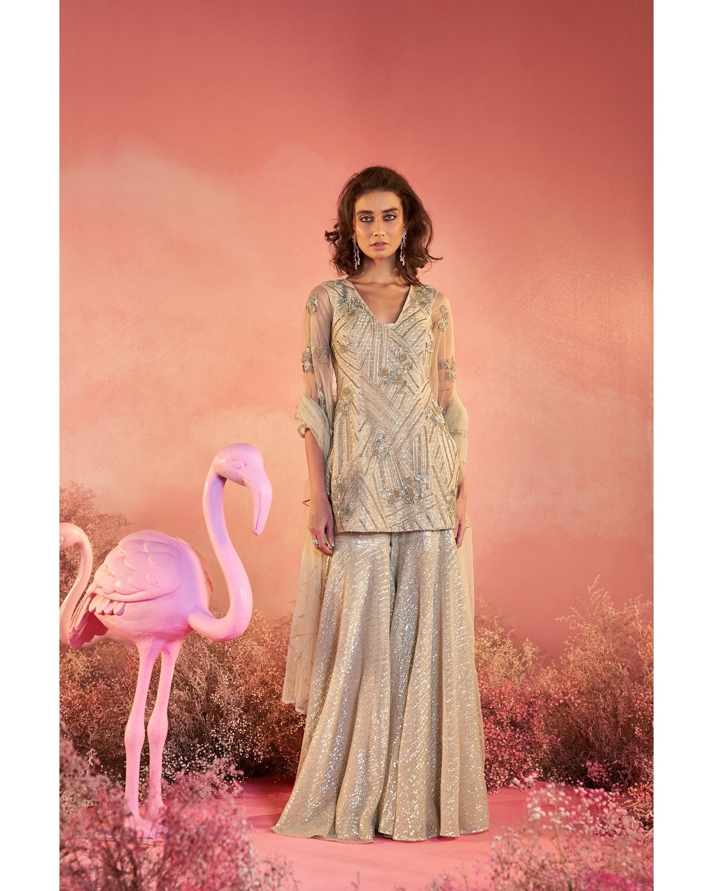 Timeless elegance in beige: Adorning the artistry of hand-embroidery in this captivating sharara set. 