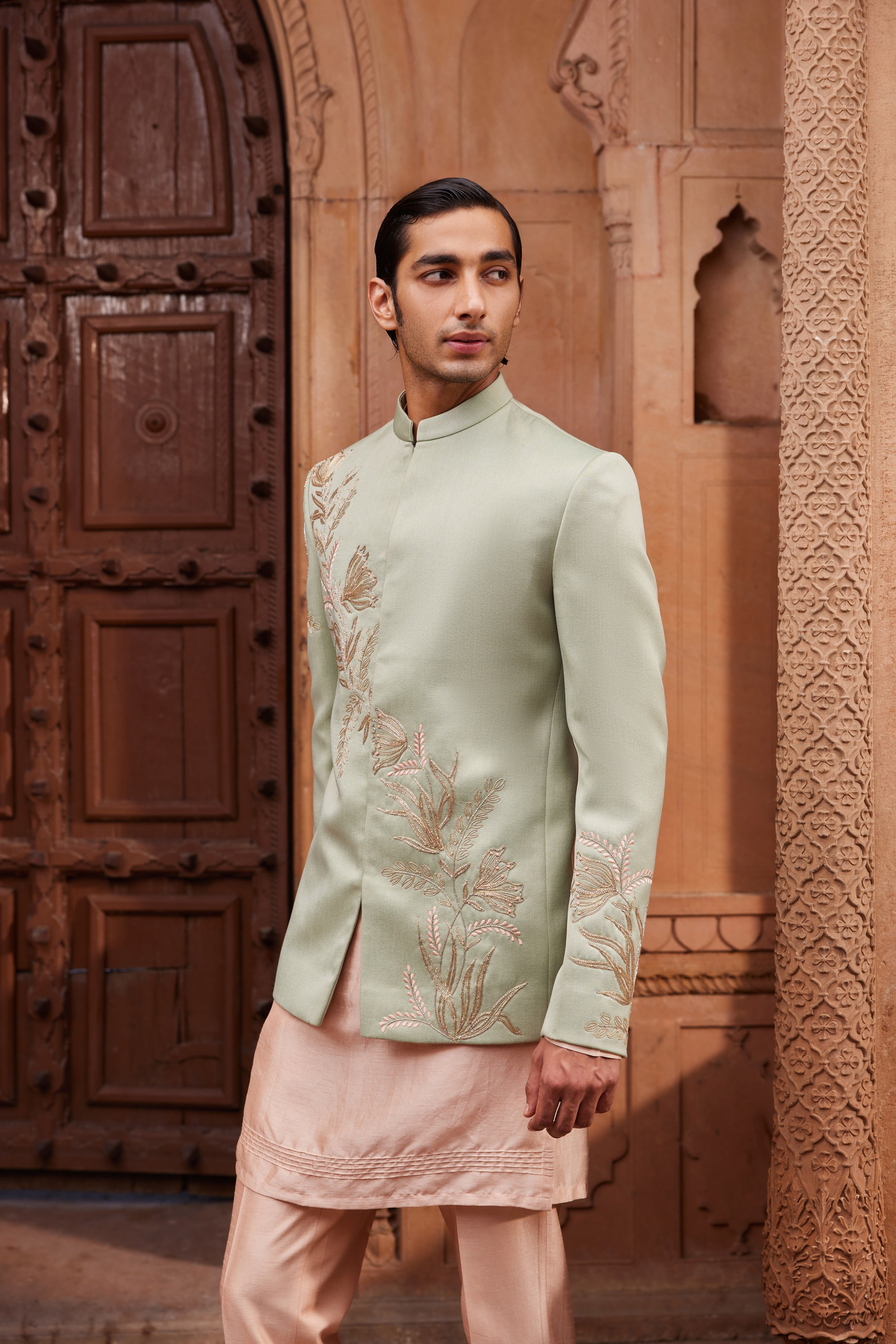 A Ruhaab Jacket Set, highlighting a jacket with intricate dori, zari, and zardozi work in floral designs, complemented by a contrast kurta and pants.