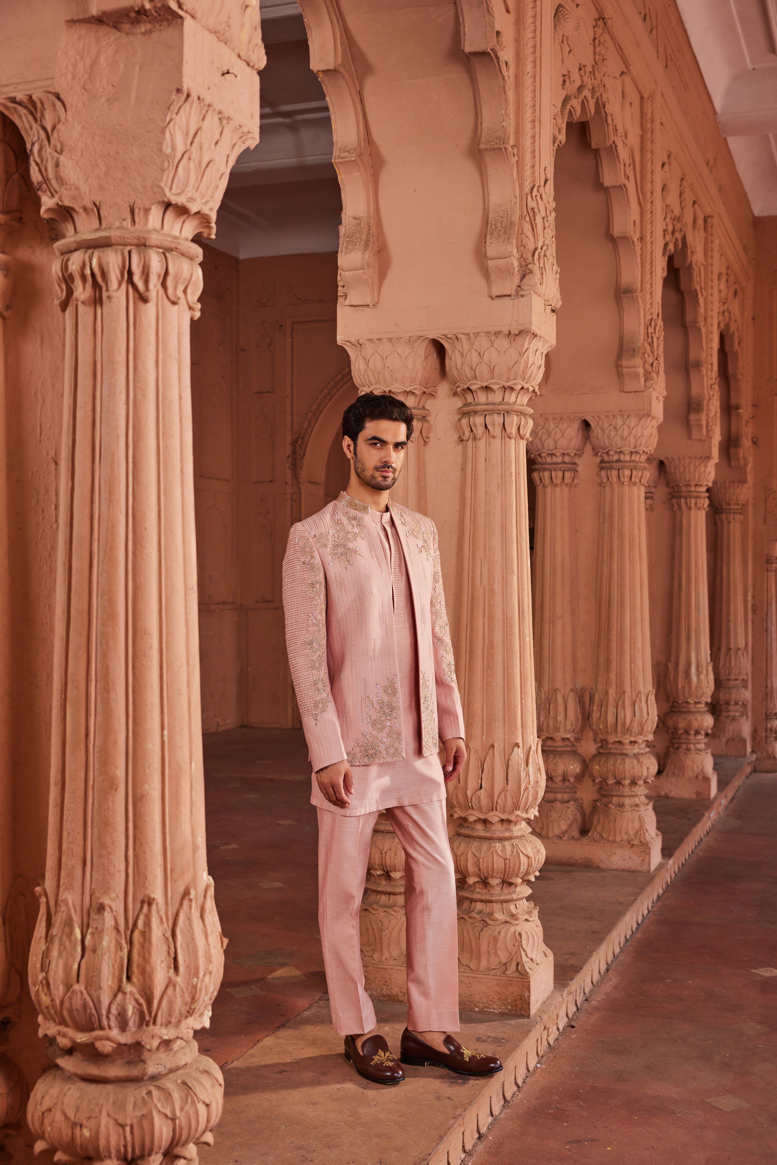 pants

ChatGPT said:
ChatGPT
A heavily embellished jacket featuring all-tonal floral and linear embroidery, intricately designed with detailed tissue applique work, paired with a kurta showcasing a refined placket and matching pants