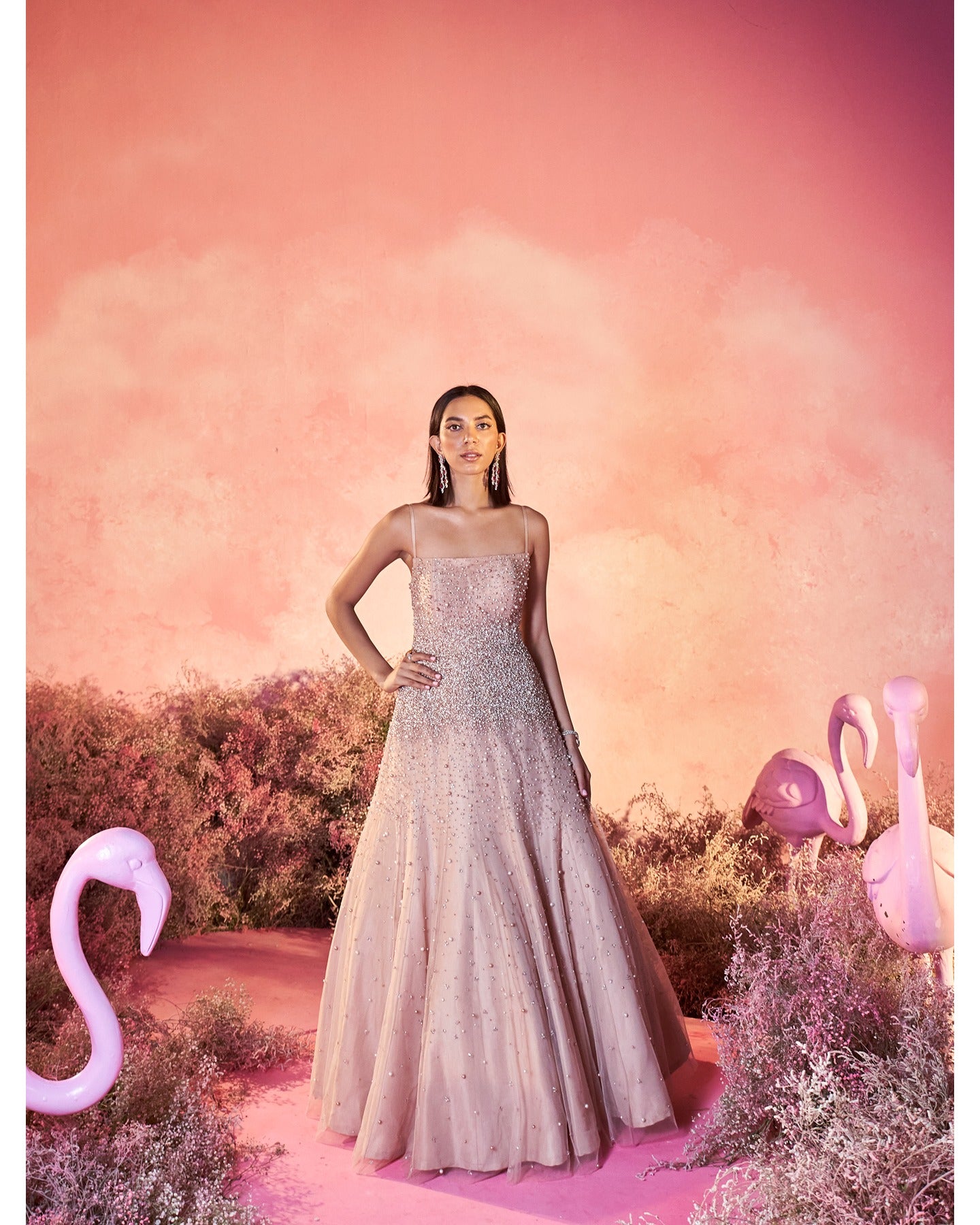 Glowing in subtlety: This light nude hand-embroidered gown is a canvas of delicate craftsmanship and timeless charm.