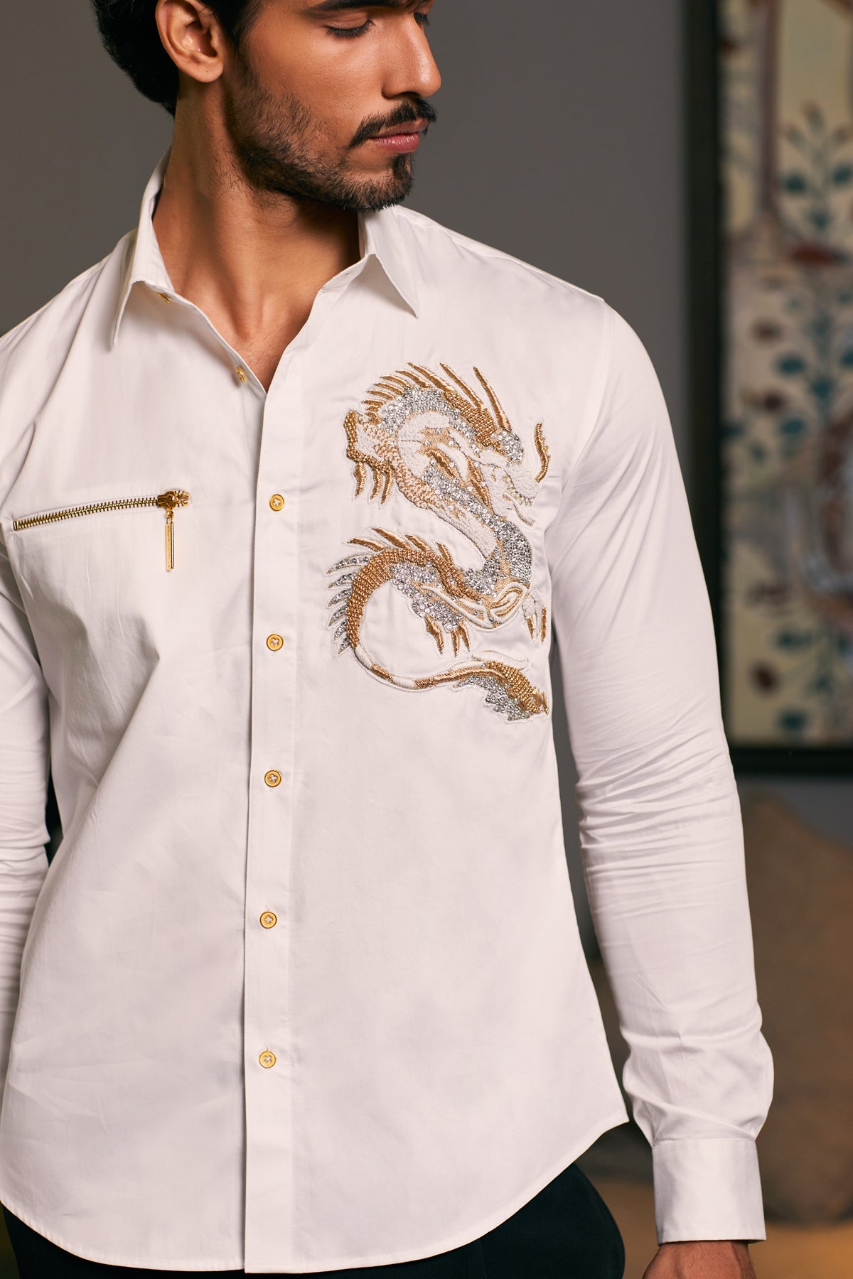 Ivory-toned satin shirt crafted from cotton, showcasing an embroidered dragon with a unique zipper detail. GOE Ivory Satin Shirt: Cotton satin shirt in an ivor