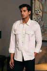 Ivory Cotton Satin Military Shirt by GOE: Features Pintuck Design and Pocket Details.