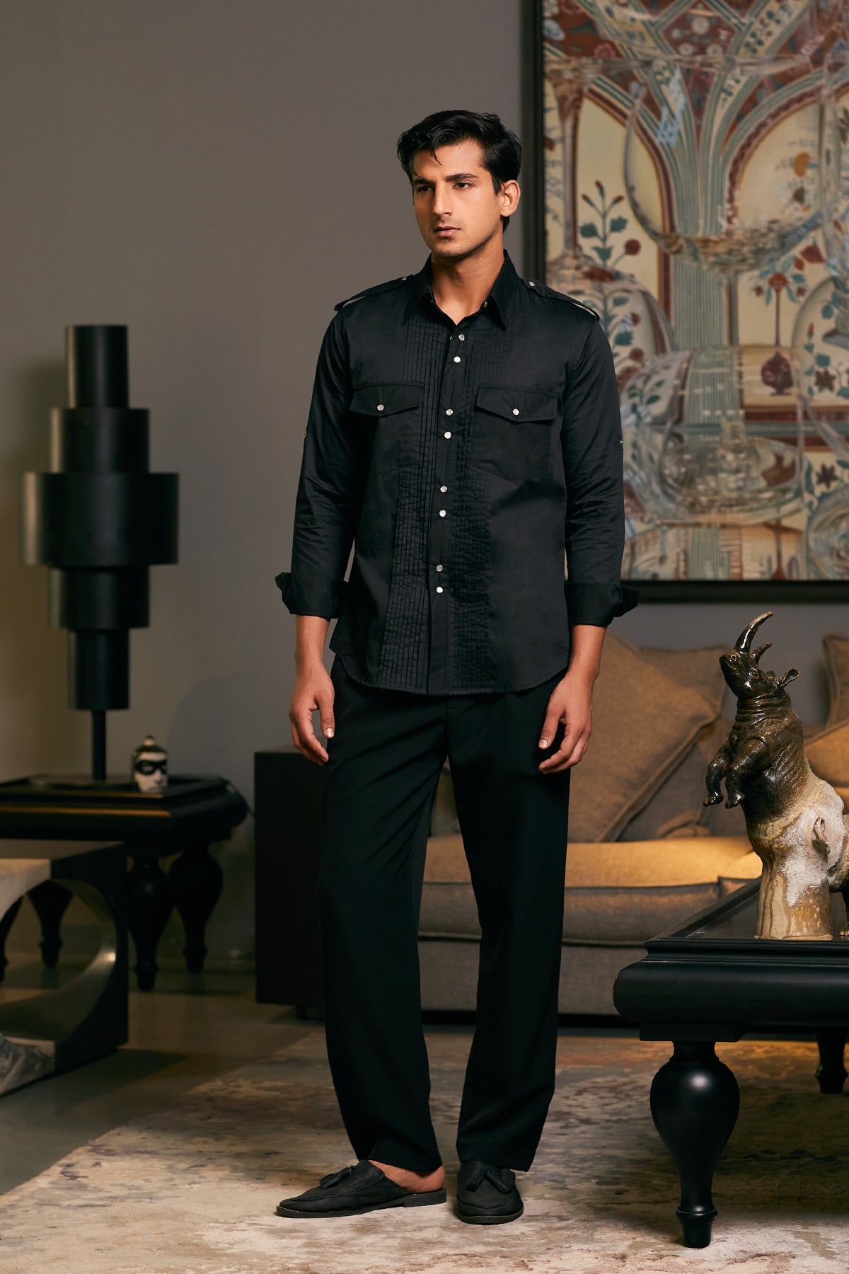 Black cotton satin military shirt with pintuck detailing and a pocket on the chest.