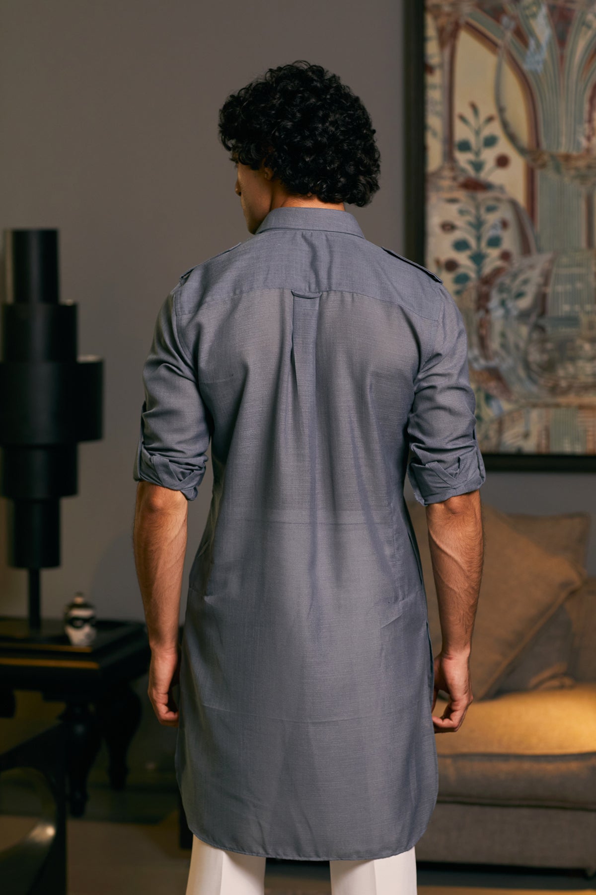 GOE kurta in slate with military accents, combining a refined appearance with bold, structured details.