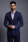 Navy knit suit with gradient self-embedded crystals on the sleeves, blending classic tailoring with modern elegance