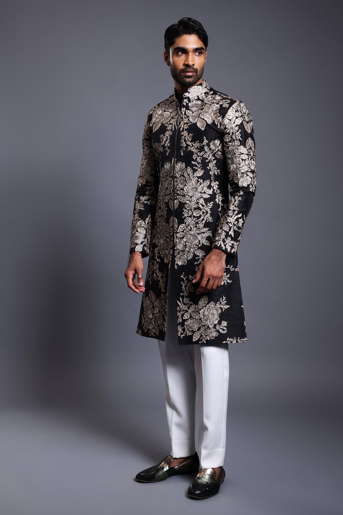 Black silk sherwani with intricate zari embroidery and delicate crystal embellishments for a luxurious look