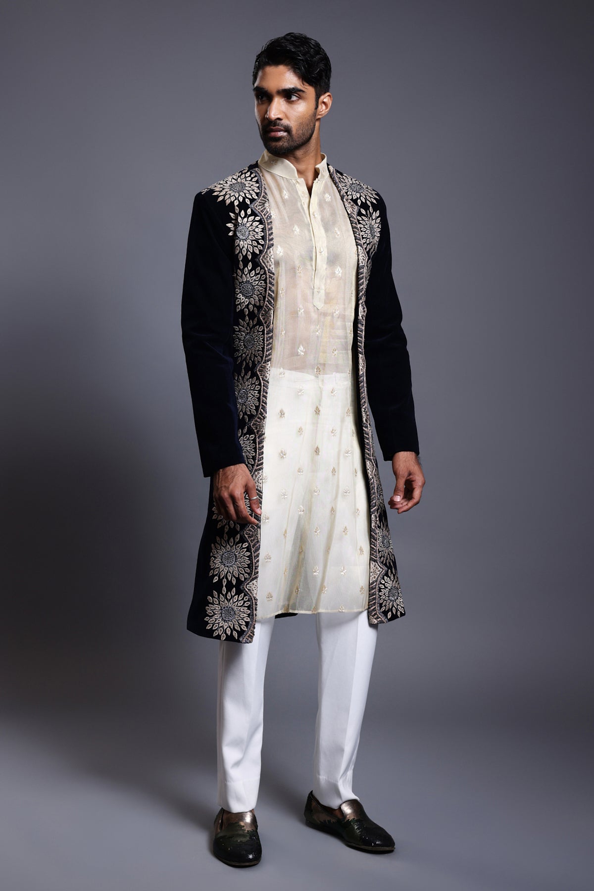 Navy velvet open sherwani with intricate applique, crystal, zircon, and crystal rope embroidery, exuding luxurious elegance