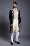 Navy velvet open sherwani with intricate applique, crystal, zircon, and crystal rope embroidery, exuding luxurious elegance