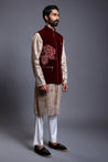 Maroon velvet bandi adorned with crystal and zari flower motifs for a luxurious and elegant look.