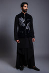 Navy velvet waistcoat with intricate crystal and zari flower embroidery, paired with a classic kurta and draped pants