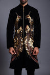 Elegant black velvet sherwani with a regal design of phoenix birds in mixed media, symbolizing rebirth and immortality