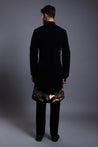 Elegant black velvet sherwani with a regal design of phoenix birds in mixed media, symbolizing rebirth and immortality