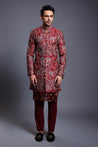 Maroon silk sherwani featuring intricate aari embroidery and a complementary chanderi kurta, blending traditional elegance with luxurious craftsmanship.