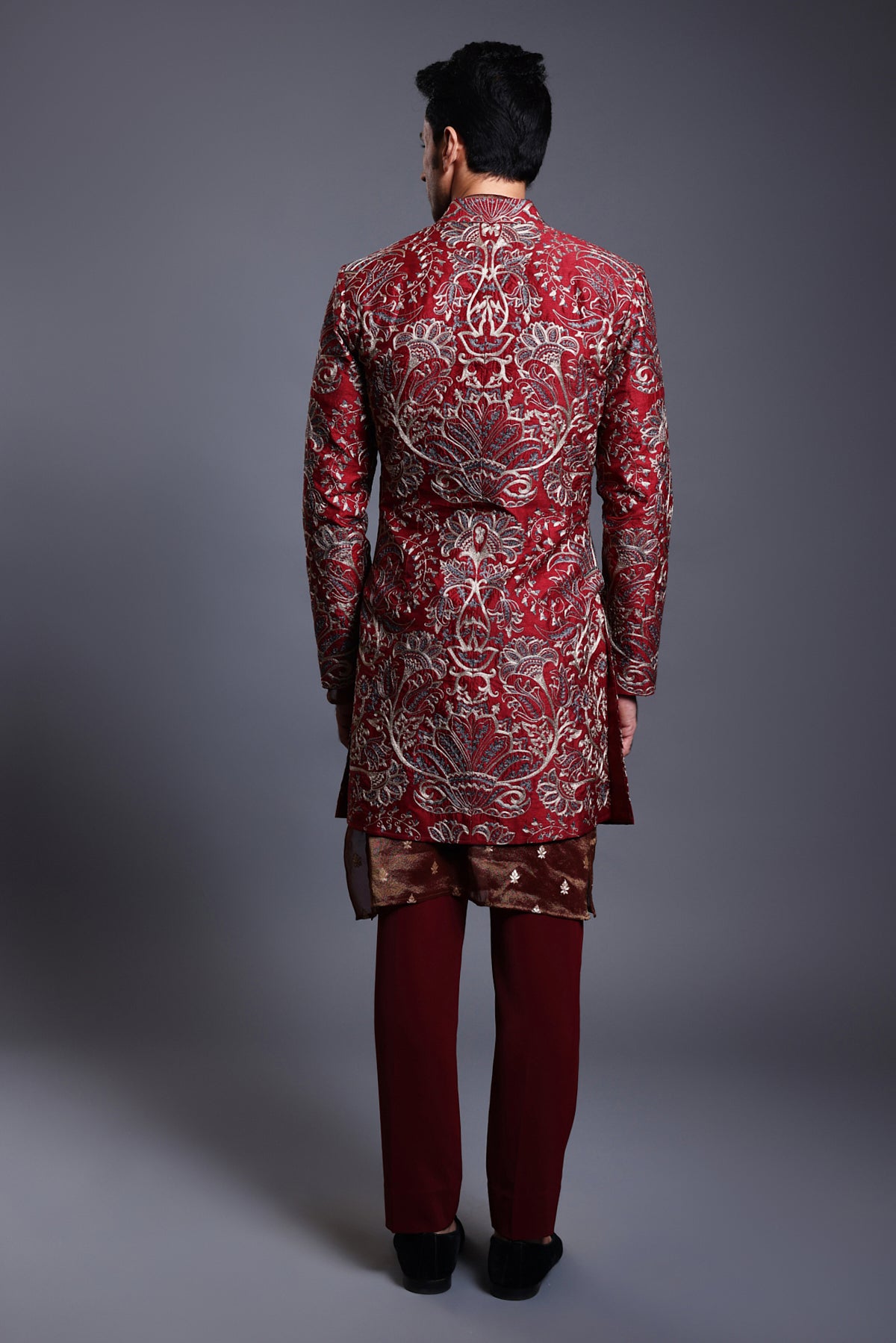 Luxurious maroon silk sherwani with ornate aari embroidery and a lightweight chanderi kurta, perfect for grand celebrations