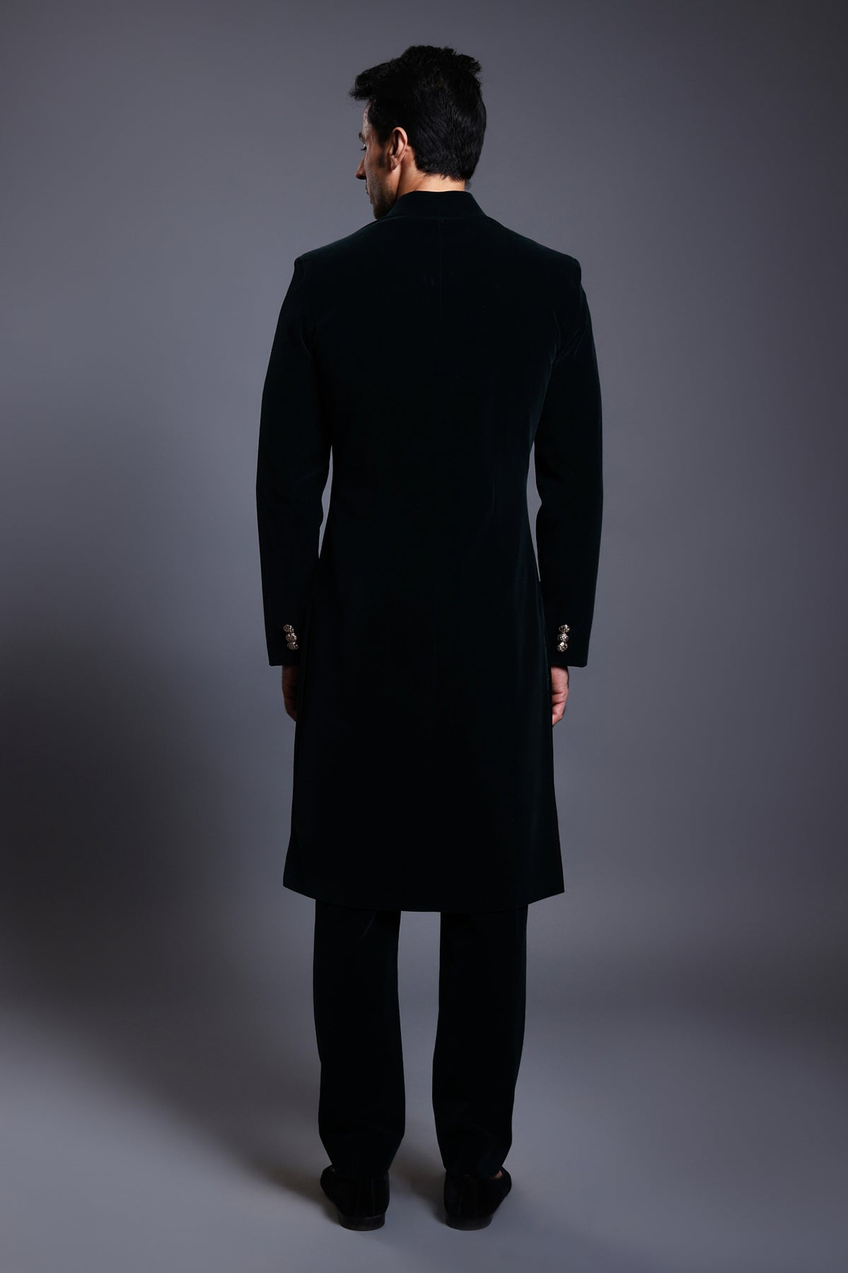 Rich navy velvet sherwani featuring opulent gold buttons for a timeless, sophisticated style