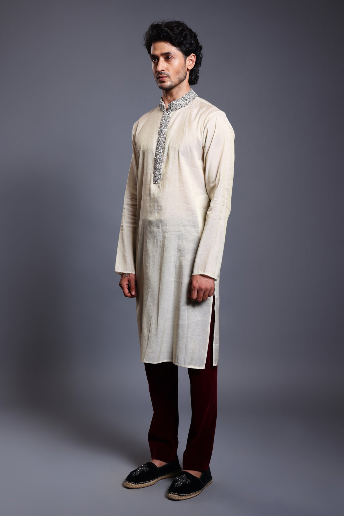 Close-up of ivory chanderi kurta featuring a crystal-adorned collar and detailed placket.