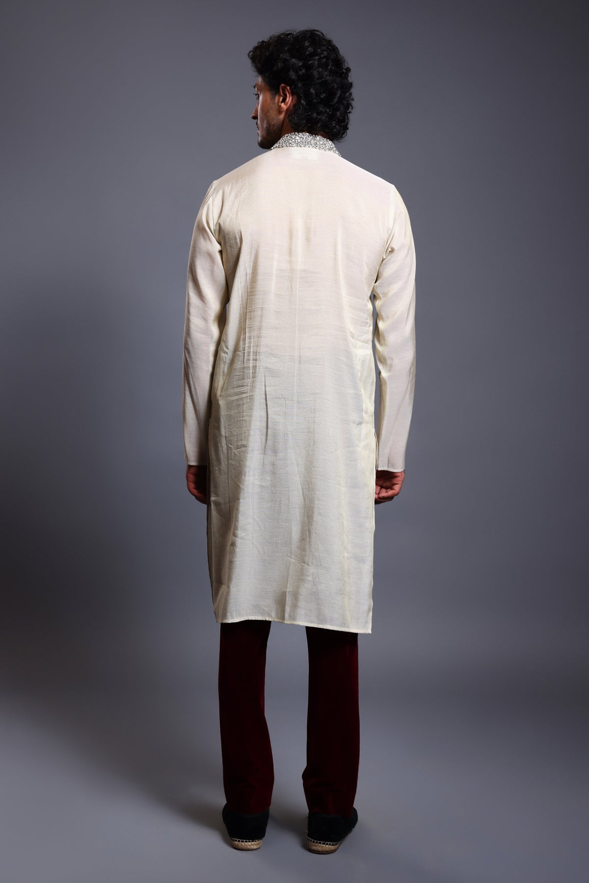 Elegant ivory and gold chanderi kurta with shimmering crystals on the collar and placket, perfect for formal occasions.