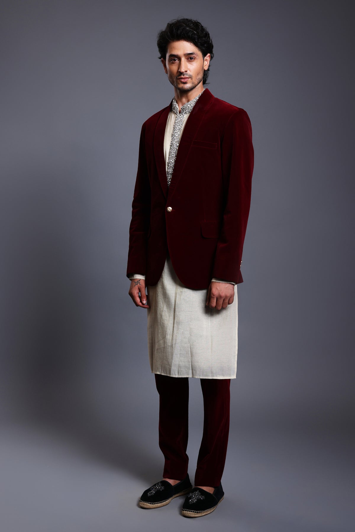 Elegant ivory chanderi kurta sherwani with gold accents, featuring detailed stripwork and shimmering crystal rope work.