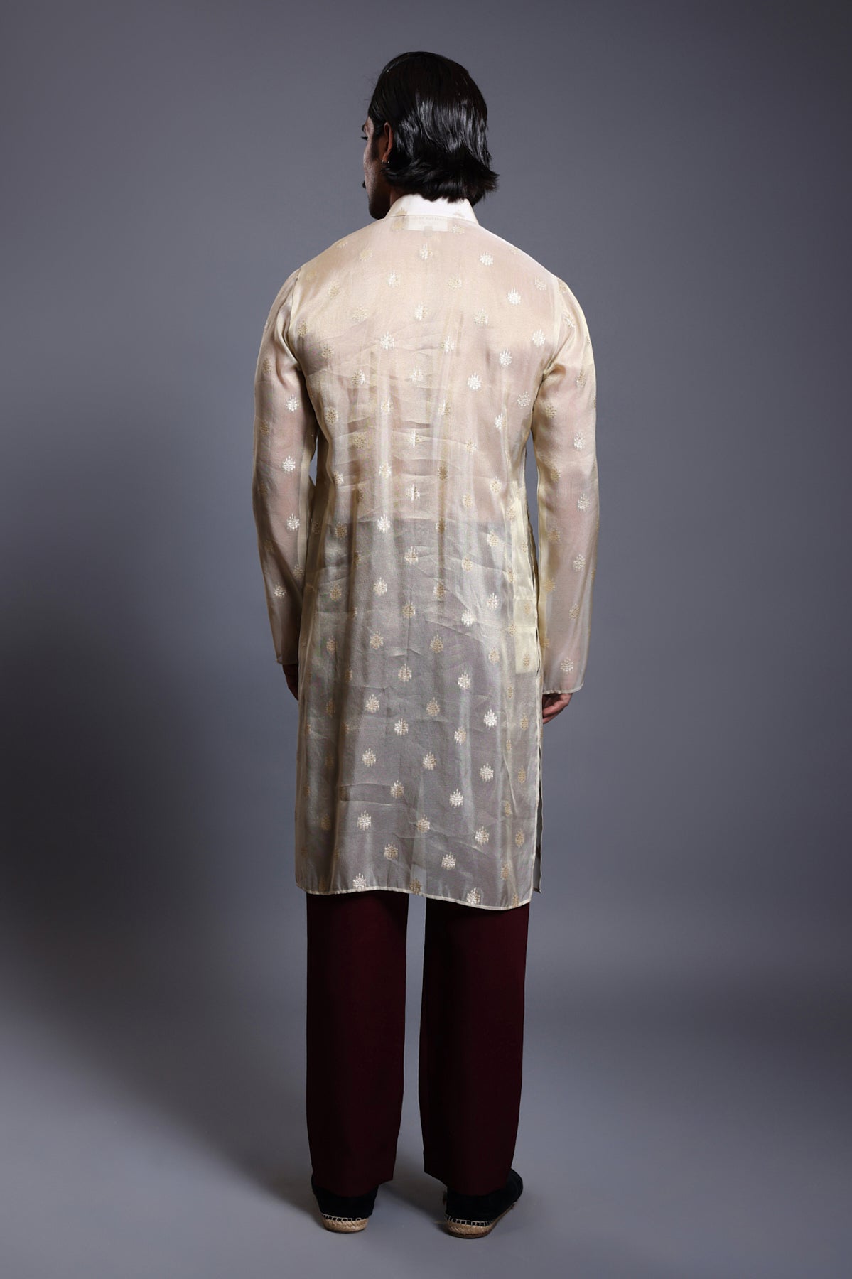 Elegant ivory and gold chanderi kurta with a detailed zari and crystal yoke, perfect for formal occasions.