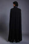 Sophisticated black microfiber overcoat with unique draped sleeves and a dramatic cape