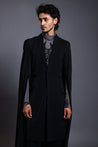 Black microfiber overcoat featuring draped sleeves and a stylish cape design.