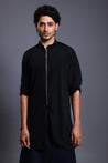 Black microfiber kurta paired with a blue draped pant skirt, blending tradition with modern flair.